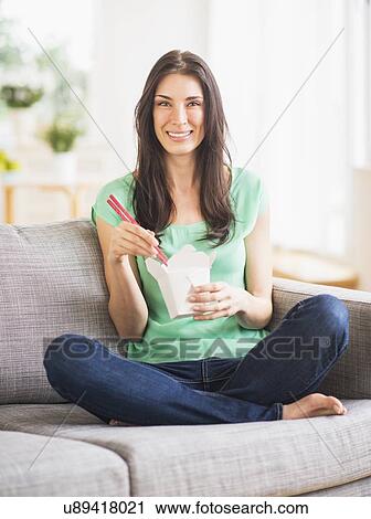 Portrait of woman eating take out food View Large Photo Image Stock Image - Portrait of woman eating take out food. Fotosearch
