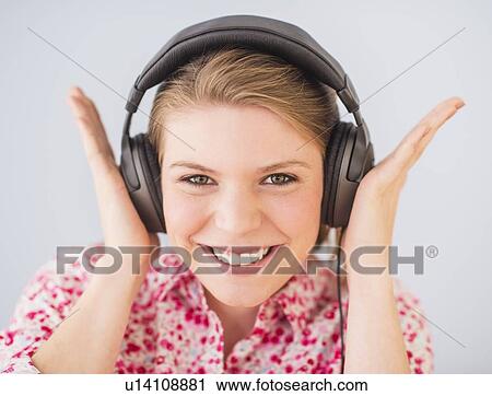 Portrait of woman in headphones View Large Photo Image Stock Image - Portrait of woman in headphones. Fotosearch