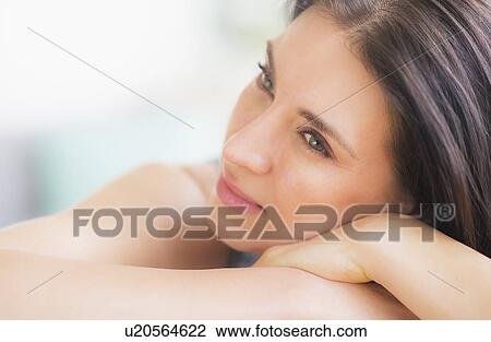 Portrait of woman relaxing on sofa View Large Photo Image Stock Image - Portrait of woman relaxing on sofa. Fotosearch