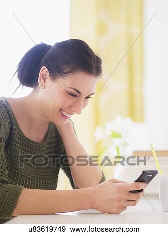 Portrait of woman using mobile phone View Large Photo Image Stock Photo - Portrait of woman using mobile phone. Fotosearch