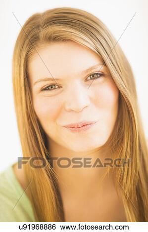 Stock Photograph - Portrait of young cute woman. Fotosearch
