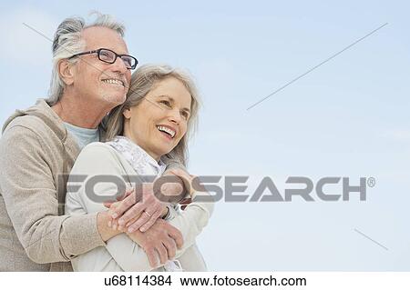 Senior couple embracing outdoors View Large Photo Image Picture - Senior couple embracing outdoors. Fotosearch