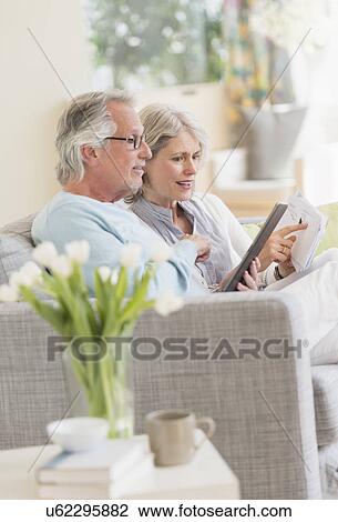 Senior couple paying bills via internet View Large Photo Image Stock Image - Senior couple paying bills via internet. Fotosearch
