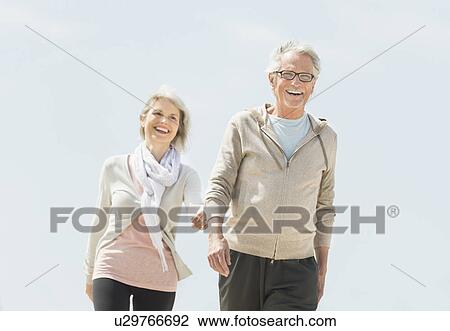 Stock Image - Senior couple walking. Fotosearch