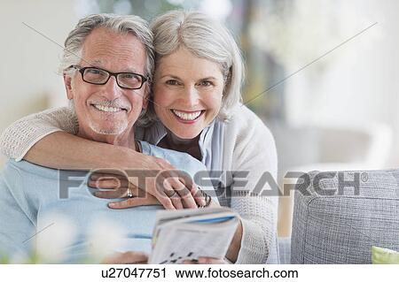 Senior woman embracing senior man View Large Photo Image Stock Image - Senior woman embracing senior man. Fotosearch