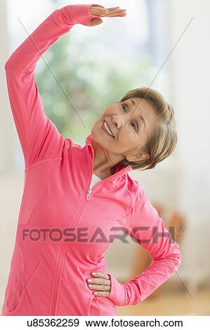 Stock Photo - Senior woman exercising. Fotosearch