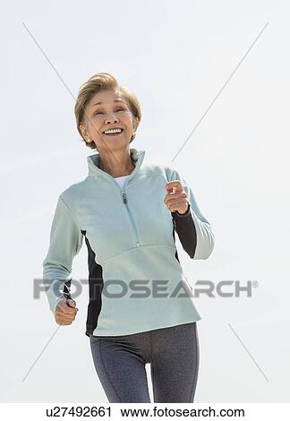 Senior woman jogging View Large Photo Image Stock Image - Senior woman jogging. Fotosearch