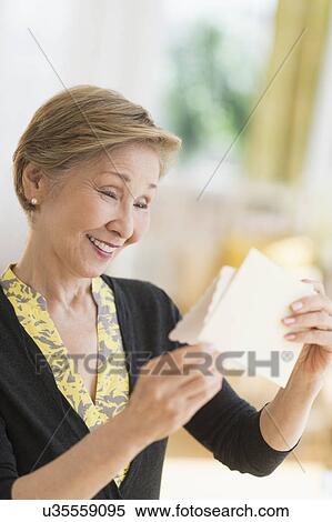 Senior woman reading note View Large Photo Image Stock Photography - Senior woman reading note. Fotosearch
