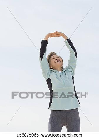 Stock Photography - Senior woman stretching. Fotosearch