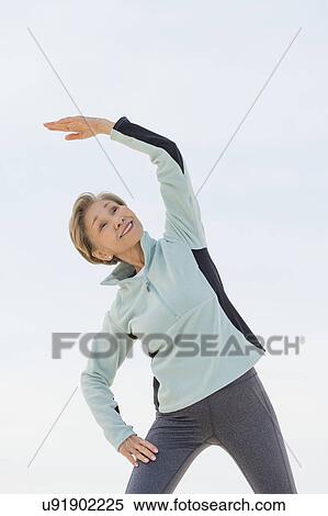 Senior woman stretching View Large Photo Image Stock Photography - Senior woman stretching. Fotosearch