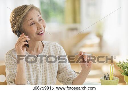 Stock Photography - Senior woman talking on phone. Fotosearch