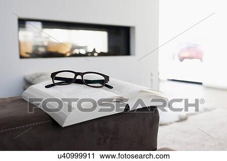 Stock Image - Spectacles on book. Fotosearch