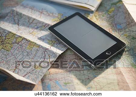 Studio Shot of maps and digital tablet View Large Photo Image Stock Image - Studio Shot of maps and digital tablet. Fotosearch