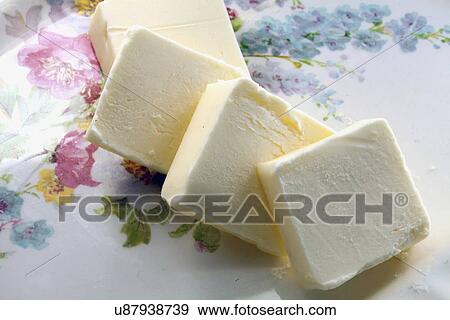 Stock Photo - Studio Shot of sliced butter. Fotosearch