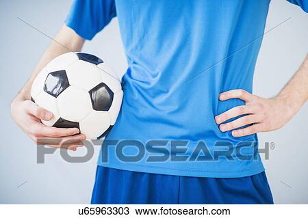 Teenage boy (14-15) holding ball View Large Photo Image Stock Image - Teenage boy (14-15) holding ball. Fotosearch