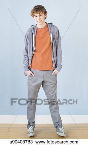 Stock Image - Teenage boy (14-15) looking at camera. Fotosearch