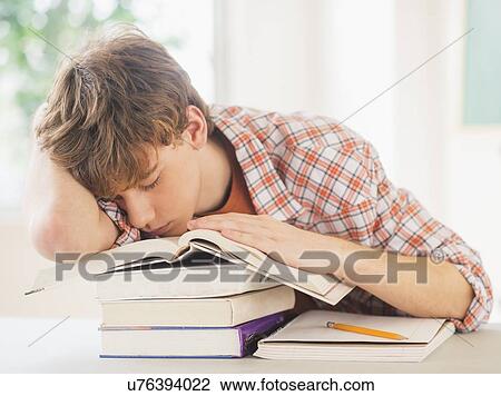 Teenage boy (14-15) sleeping in classroom View Large Photo Image Stock Image - Teenage boy (14-15) sleeping in classroom. Fotosearch