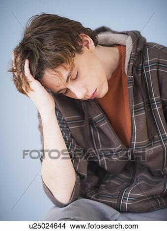 Tired teenage boy (14-15) View Large Photo Image Picture - Tired teenage boy (14-15). Fotosearch