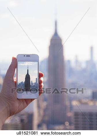 Tourist taking photo of Empire State Building View Large Photo Image Stock Image - Tourist taking photo of Empire State Building. Fotosearch