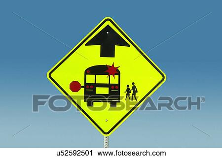 Stock Image - Warning sign against blue sky. Fotosearch