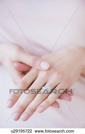 Woman hands with engagement ring View Large Photo Image Stock Image - Woman hands with engagement ring. Fotosearch