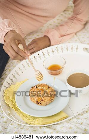 Woman having breakfast in bed View Large Photo Image Stock Image - Woman having breakfast in bed. Fotosearch