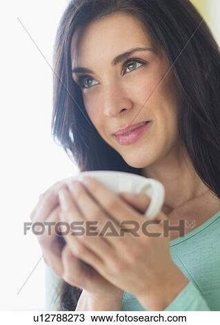 Woman with cup in hand View Large Photo Image Stock Image - Woman with cup in hand. Fotosearch