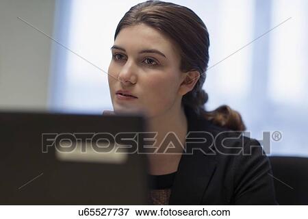 Woman working on laptop View Large Photo Image Stock Photo - Woman working on laptop. Fotosearch