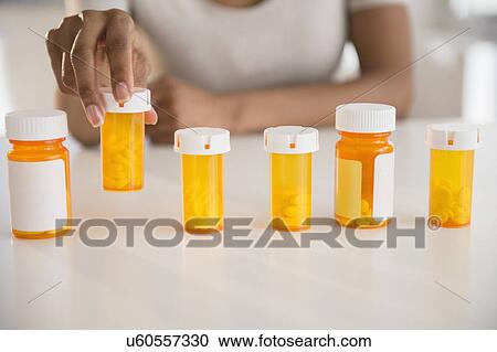 Woman's hand holding medicine View Large Photo Image Stock Image - Woman's hand holding medicine. Fotosearch