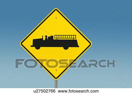 Stock Photograph - Yellow road sign depicting fire truck. Fotosearch