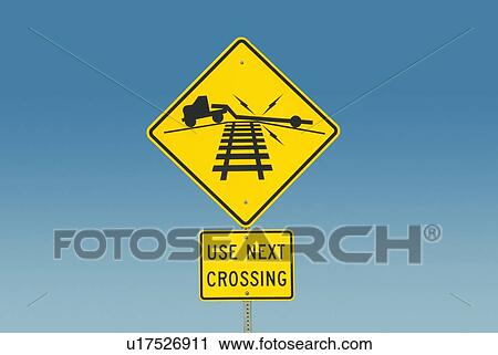 Stock Image - Yellow road sign depicting truck on railroad crossing. Fotosearch