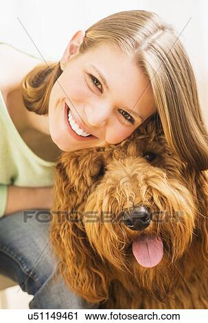 Young cheerful woman with her dog View Large Photo Image Stock Image - Young cheerful woman with her dog. Fotosearch