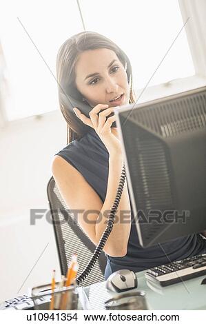 Young woman doing home finances View Large Photo Image Picture - Young woman doing home finances. Fotosearch