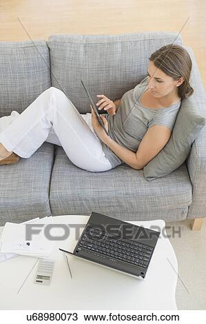 Young woman doing home finances View Large Photo Image Stock Image - Young woman doing home finances. Fotosearch