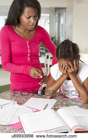 Angry Mother Telling Off Daughter About Homework View Large Photo Image Stock Photo - Angry Mother Telling Off Daughter About Homework. Fotosearch