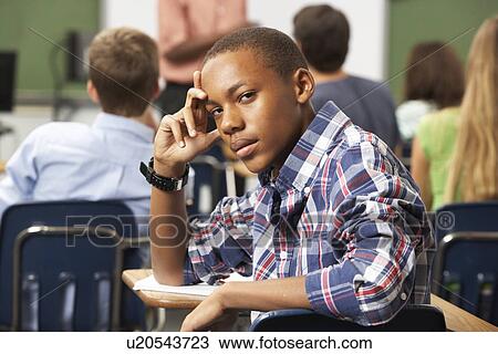 Bored Male Teenage Pupil In Classroom View Large Photo Image Stock Image - Bored Male Teenage Pupil In Classroom. Fotosearch