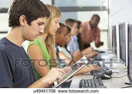 Boy Using Digital Tablet In Computer Class View Large Photo Image Stock Photo - Boy Using Digital Tablet In Computer Class. Fotosearch