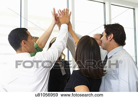 Business Team Giving One Another High Five View Large Photo Image Stock Photo - Business Team Giving One Another High Five. Fotosearch