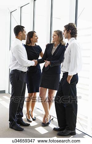 Business Team Having Informal Meeting In Office View Large Photo Image Stock Photo - Business Team Having Informal Meeting In Office. Fotosearch