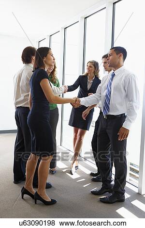 Business Team Having Informal Meeting In Office View Large Photo Image Stock Photo - Business Team Having Informal Meeting In Office. Fotosearch