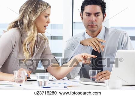 Businessman And Businesswoman Meeting In Office View Large Photo Image Stock Image - Businessman And Businesswoman Meeting In Office. Fotosearch