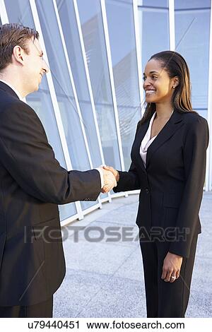 Businessman And Businesswomen Shaking Hands Outside Office View Large Photo Image Stock Image - Businessman And Businesswomen Shaking Hands Outside Office. Fotosearch