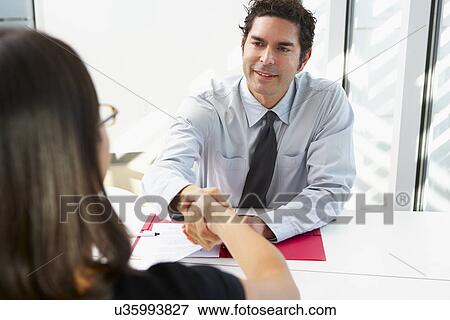 Businessman Interviewing Female Candidate For Job View Large Photo Image Stock Photo - Businessman Interviewing Female Candidate For Job. Fotosearch