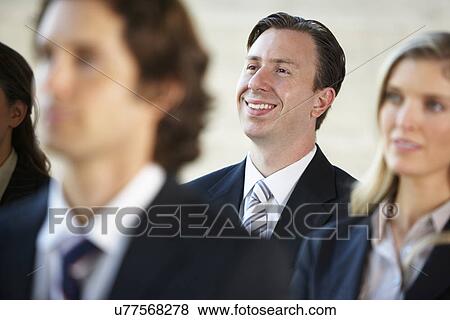 Businessman Listening To Speaker At Conference View Large Photo Image Stock Photo - Businessman Listening To Speaker At Conference. Fotosearch
