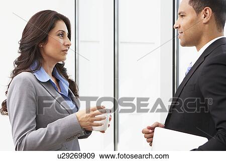 Businesspeople Having Informal Meeting In Office View Large Photo Image Stock Photo - Businesspeople Having Informal Meeting In Office. Fotosearch
