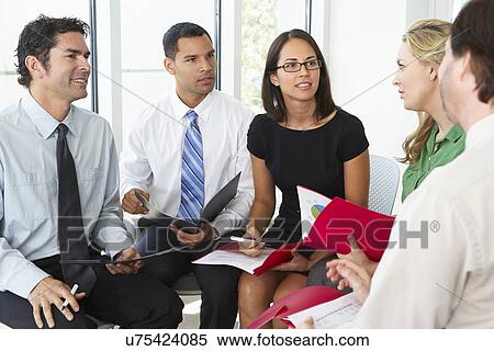 Businesspeople Having Informal Office Meeting View Large Photo Image Stock Photography - Businesspeople Having Informal Office Meeting. Fotosearch