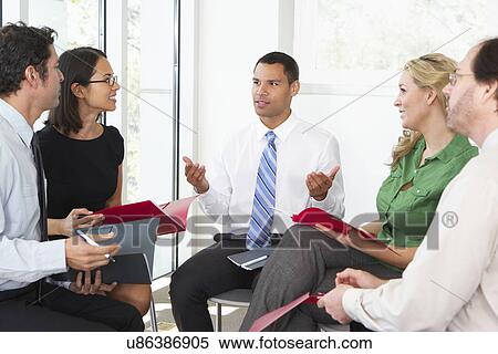 Businesspeople Having Informal Office Meeting View Large Photo Image Stock Photography - Businesspeople Having Informal Office Meeting. Fotosearch