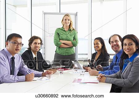 Businesswoman Conducting Meeting In Boardroom View Large Photo Image Stock Image - Businesswoman Conducting Meeting In Boardroom. Fotosearch