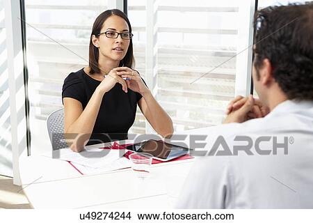 Businesswoman Interviewing Male Candidate For Job View Large Photo Image Picture - Businesswoman Interviewing Male Candidate For Job. Fotosearch