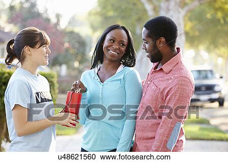 Charity Worker Collecting Sponsorship From Couple In Street View Large Photo Image Stock Image - Charity Worker Collecting Sponsorship From Couple In Street. Fotosearch